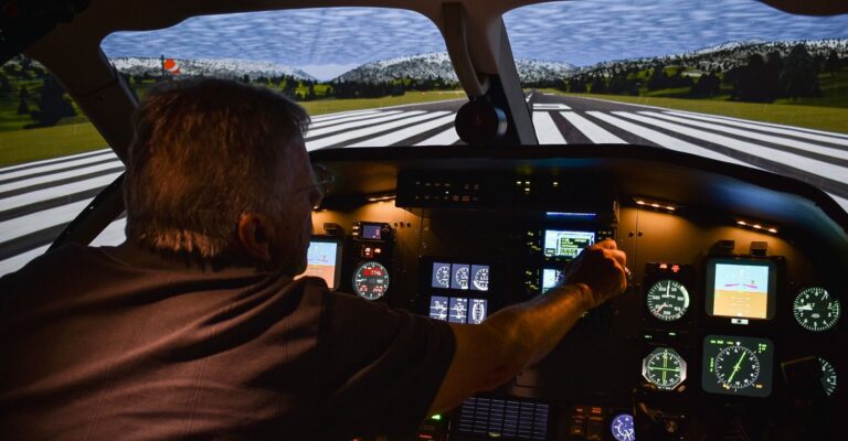 A man inside the PC-12 simulator