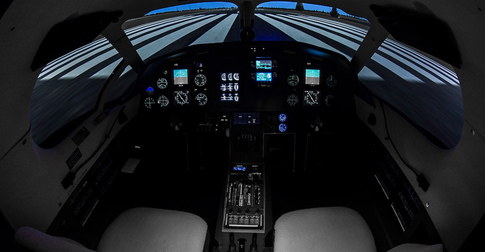 The PC-12 simulator with images of a landing strip