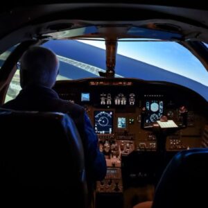 A person in the CE 500 full flight simulator