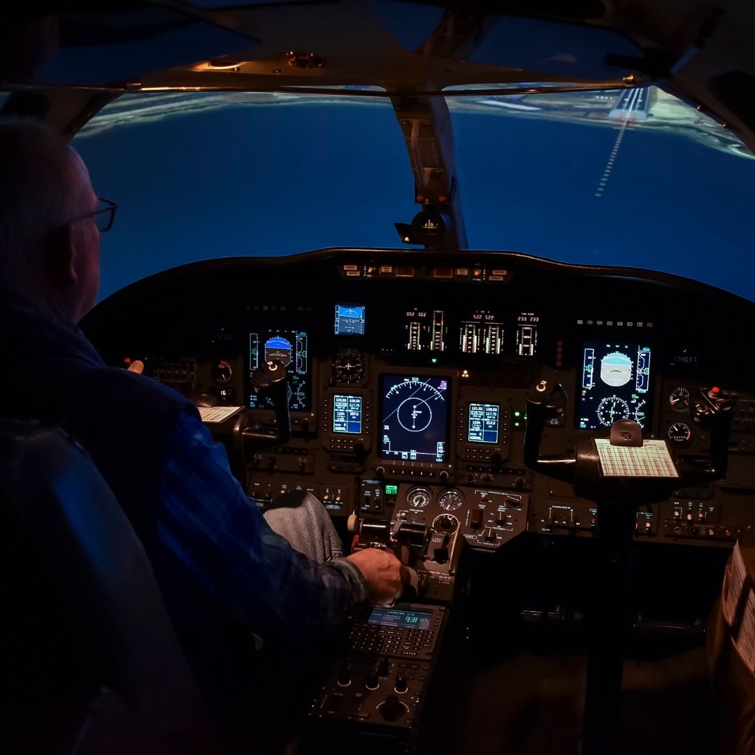 The inside of a flight simulator being flown